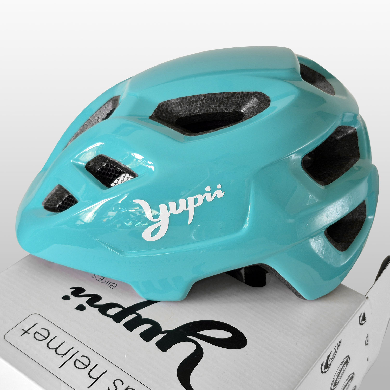 kask yupii mietowy widok z boku i detale